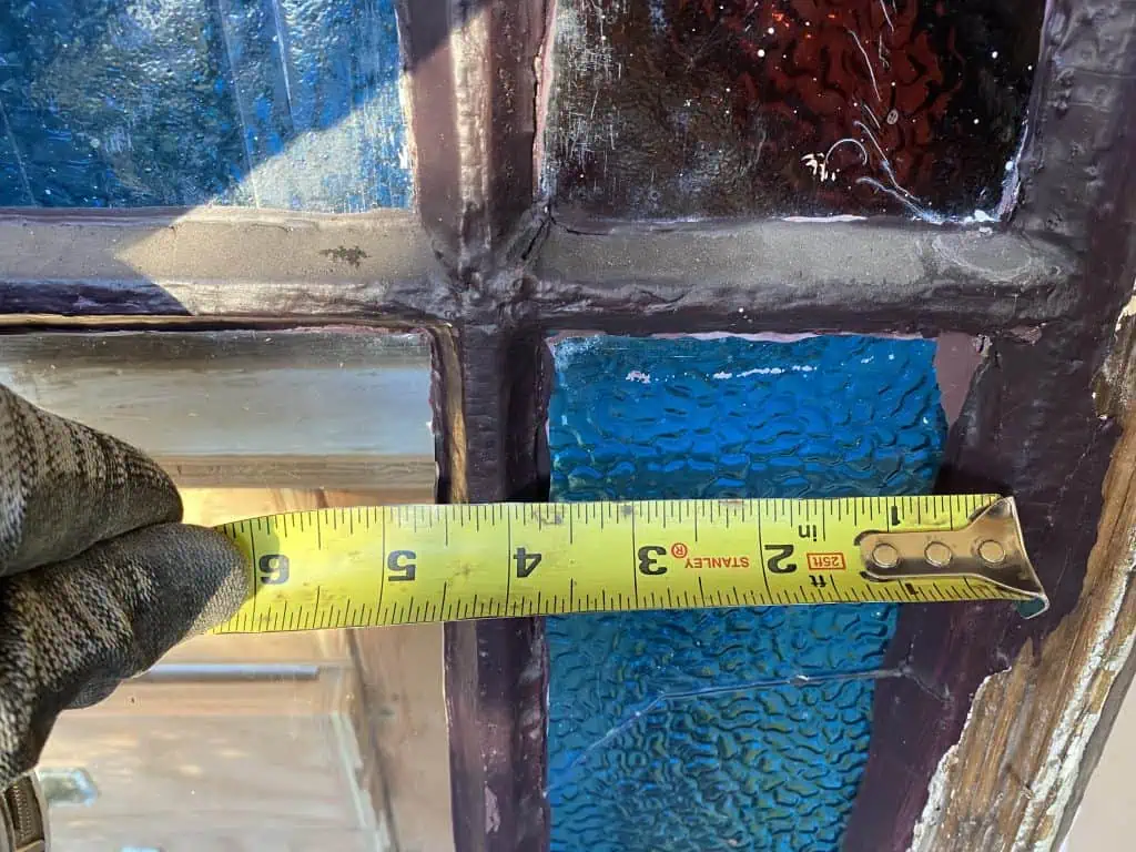 Many layers of paint applied to exterior side of sash